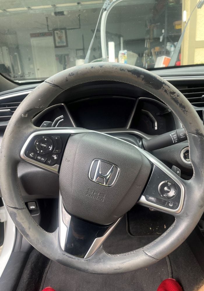 Clean steering wheel interior detailing in Florida