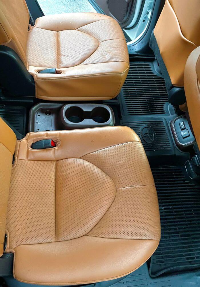 Polished leather seat after professional car cleaning in Florida (2)